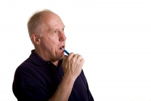 Older Man Brushing Teeth