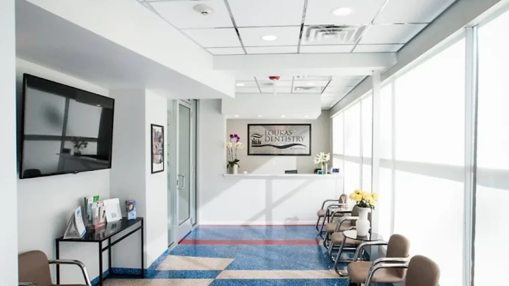 Loukas Dentistry reception lobby with front desk and office sign