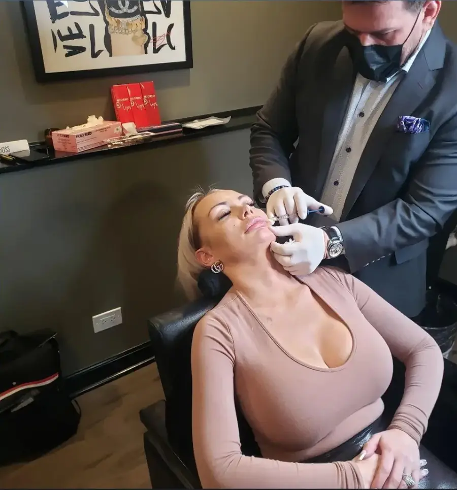 Dr. Thanasi Loukas performing an injectable treatment for a guest at a Botox and filler party hosted by Loukas Dentistry in Park Ridge, IL
